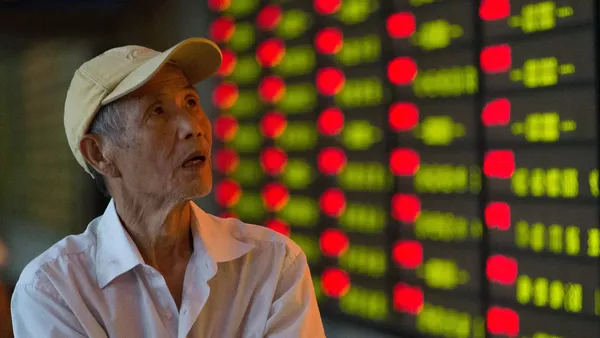 A man watches China's stock market. He is not thrilled.