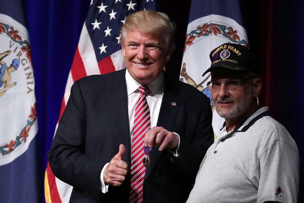 Trump with veteran Louis Dorfman on Tuesday.