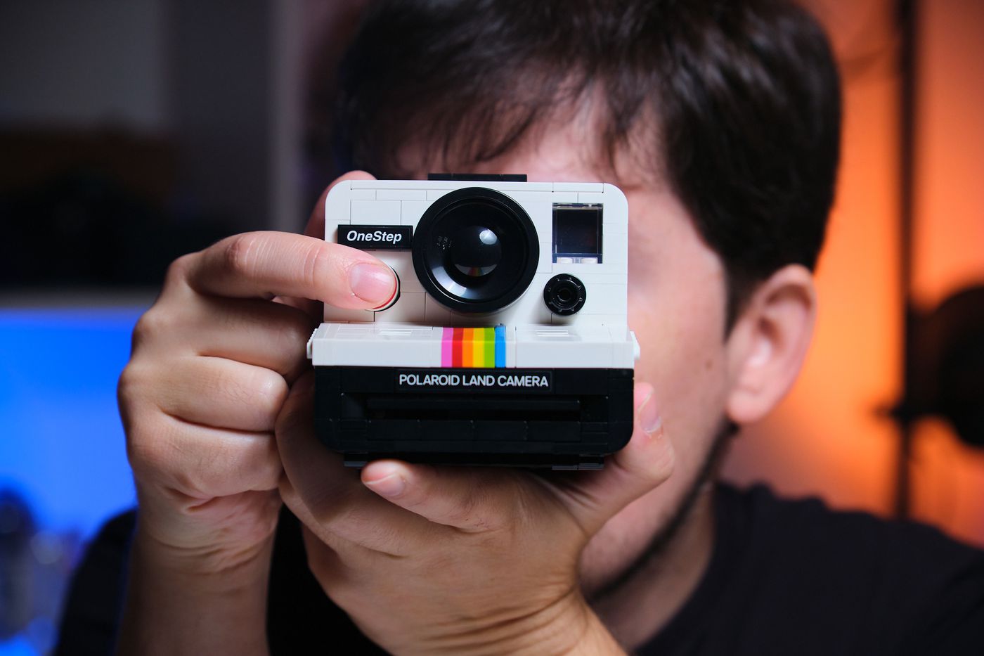 I hold up the final prototype of Lego’s Polaroid as if to take a photo, with its iconic “OneStep” and “Polaroid Land Camera” badges on display.